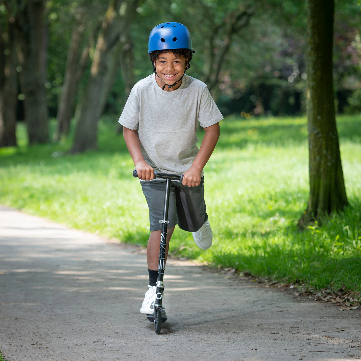 EVO Children&#39;s Inline Scooter for Kids Ages 5 and Up with Adjustable Handlebar, perfect for enhancing motor skills and outdoor fun.