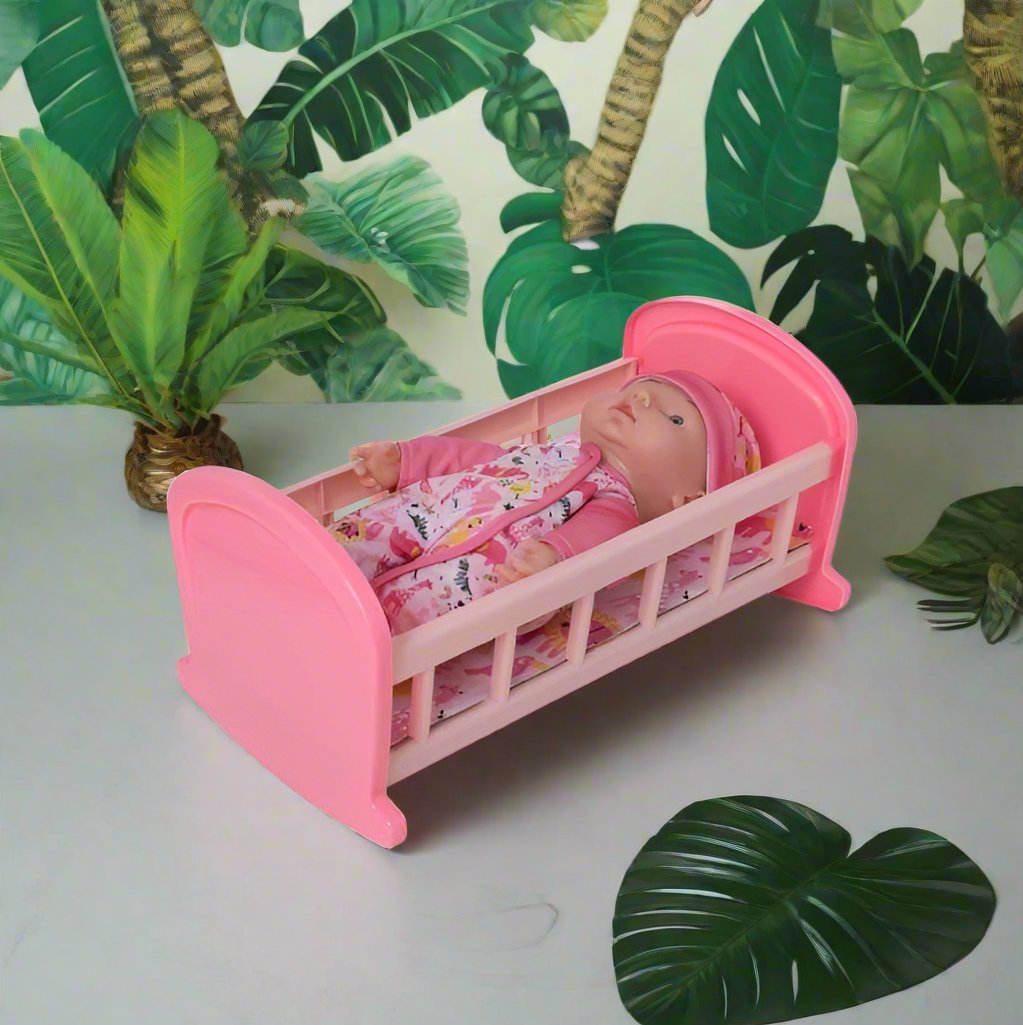 Complete with included doll, this charming cot offers a cozy resting place for dolls, fostering imaginative play and nurturing skills in children