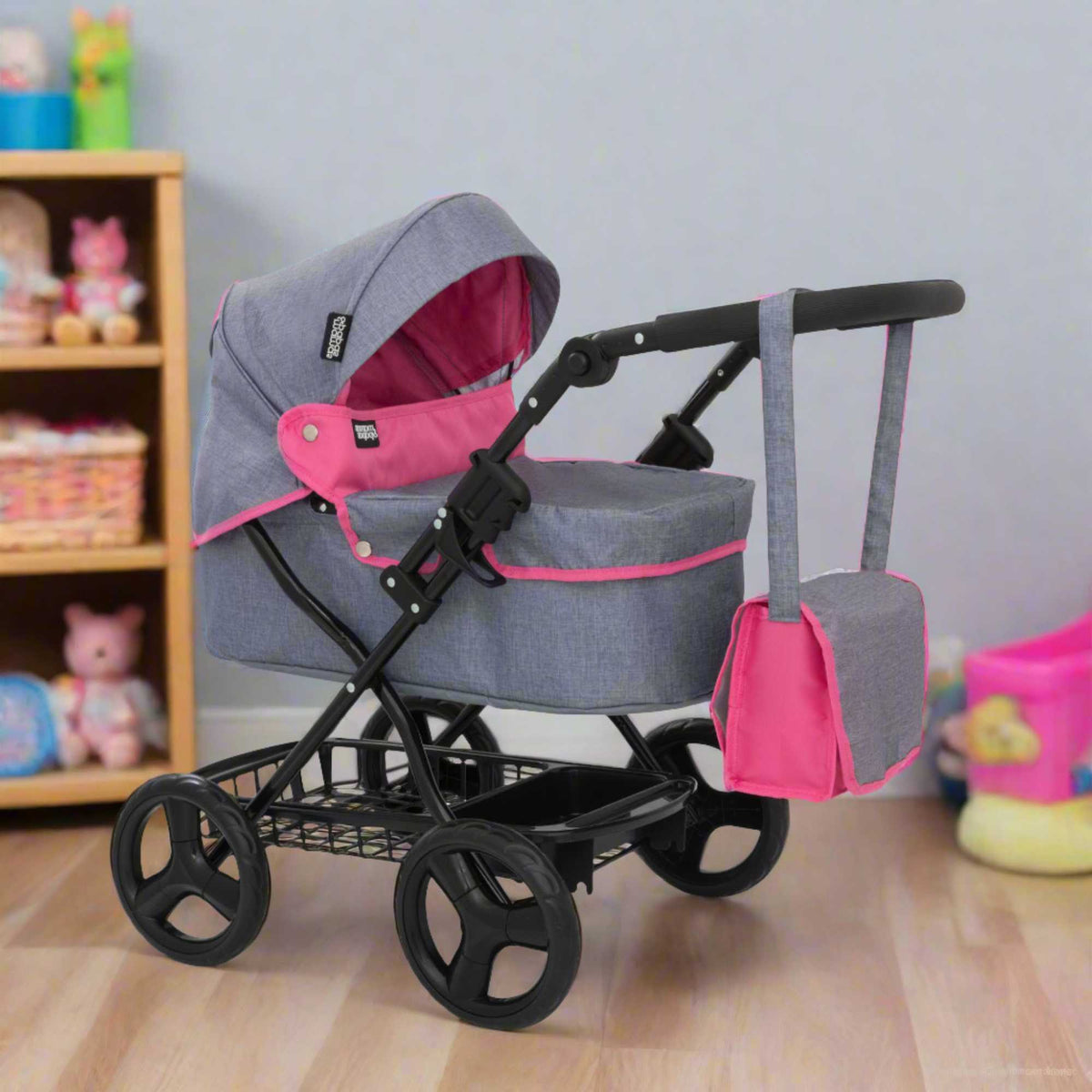 Mamas &amp; Papas Junior Ultima Dolls Pram, designed for children&#39;s play, featuring a classic and sturdy frame, adjustable handle height, and smooth-rolling wheels, ideal for nurturing imaginative play with dolls.