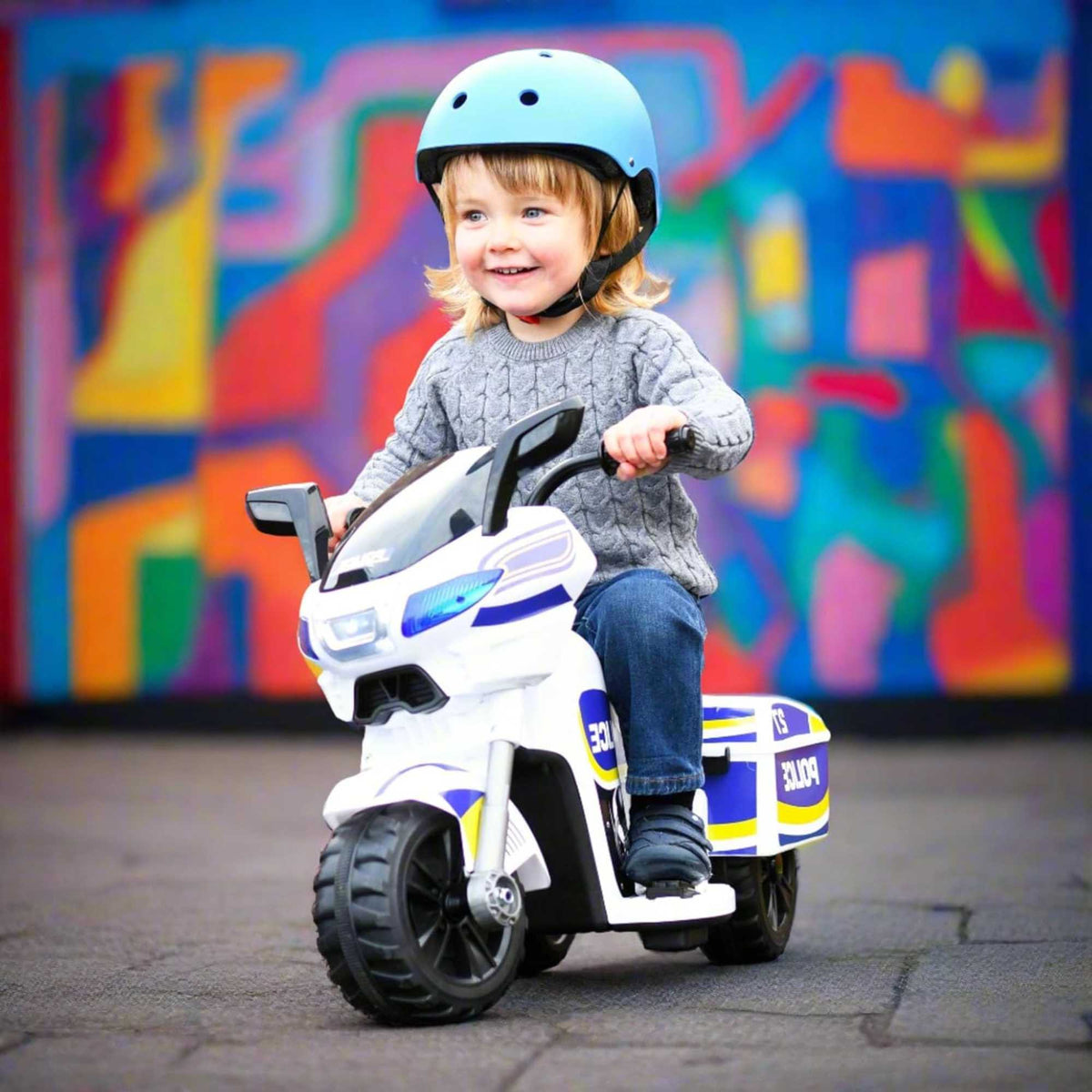 EVO Police Sport Bike Ride On for ages 2+, featuring a realistic police bike design with flashing lights and authentic sounds, durable frame, wide stable wheels, and easy-grip handles for safe and exciting outdoor play.