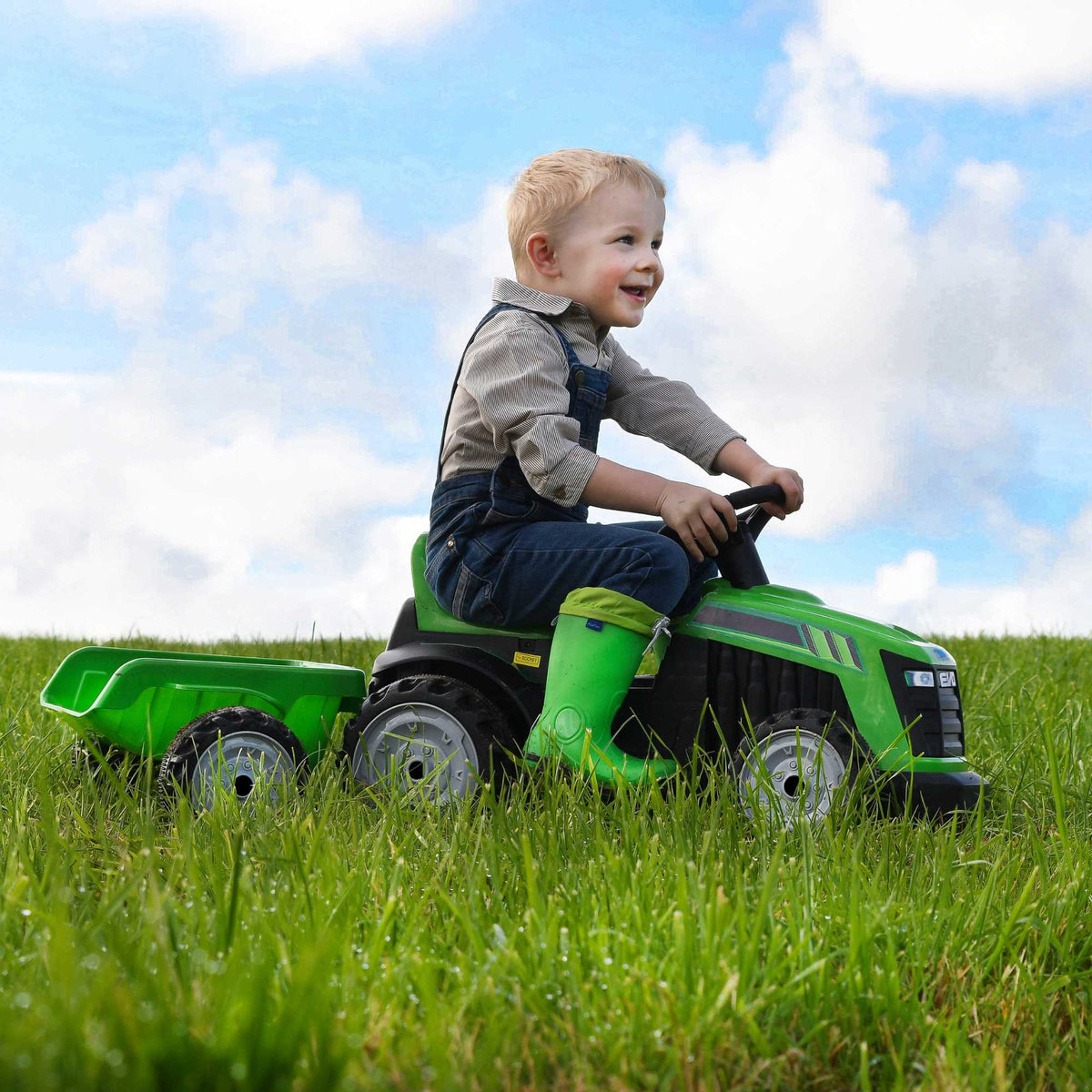 Electric green EVO Green Tractor &amp; Trailer Ride-On for 2-year-olds, featuring a realistic tractor design, detachable trailer, ergonomic seat, and easy-to-use controls for safe and fun farmyard adventures.