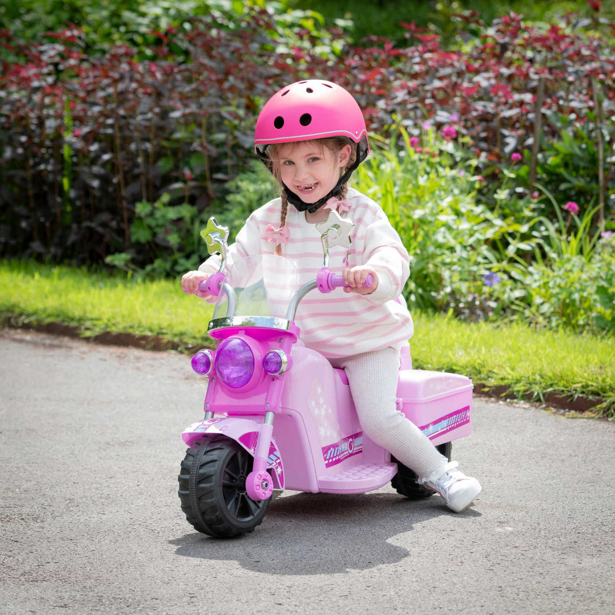 Image of the EVO Children&#39;s Electric Ride-On Shimmer Trike Toy. The trike is shown in an outdoor setting, highlighting its fun and adventurous appeal for young riders.