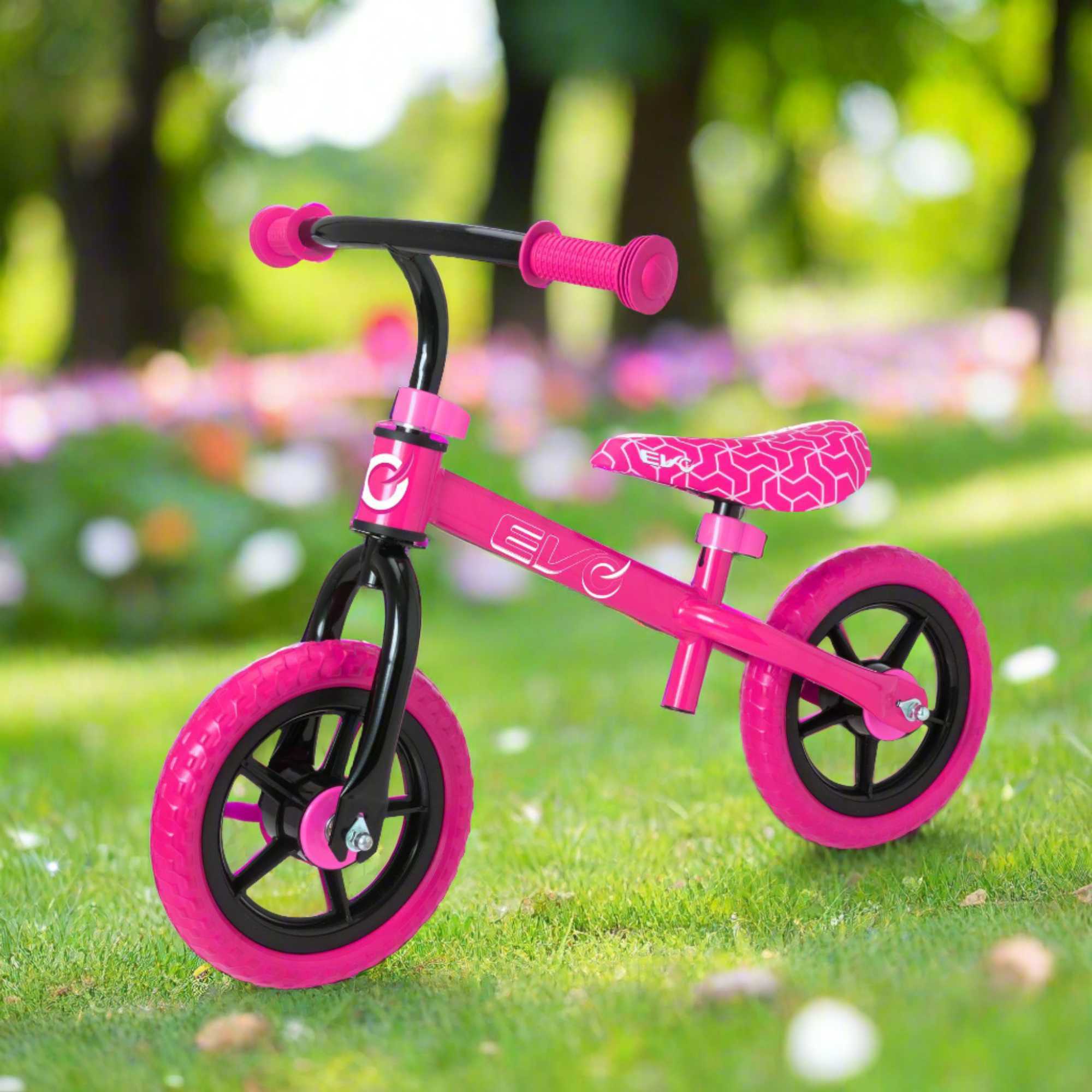 Child riding the EVO Balance Bike outdoors, showcasing the lightweight and durable design perfect for young learners to develop their balance and coordination skills