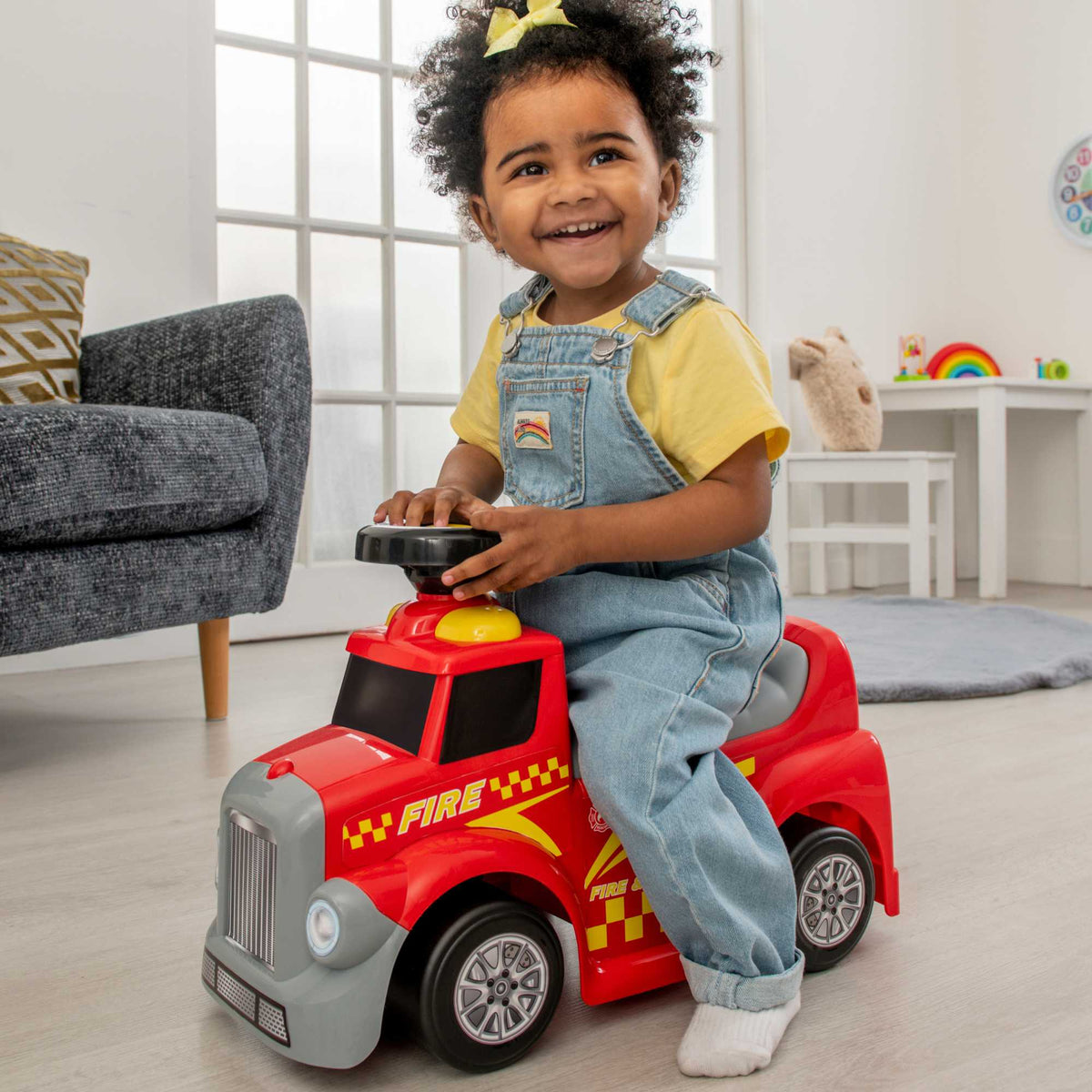 EVO Foot 2 Floor Ride-On Fire Engine for children aged 1 and up, featuring a vibrant red design, wide wheelbase, and foot-to-floor propulsion for safe and imaginative play.