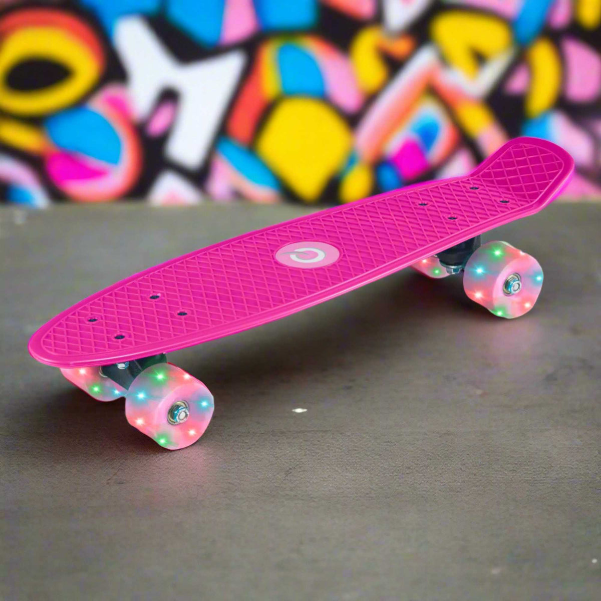 Children’s EVO 22-inch Penny Board in pink with light-up wheels, showcasing a compact design and vibrant retro style, perfect for young riders. The board features a textured grip surface and smooth, illuminated wheels that light up during movement.