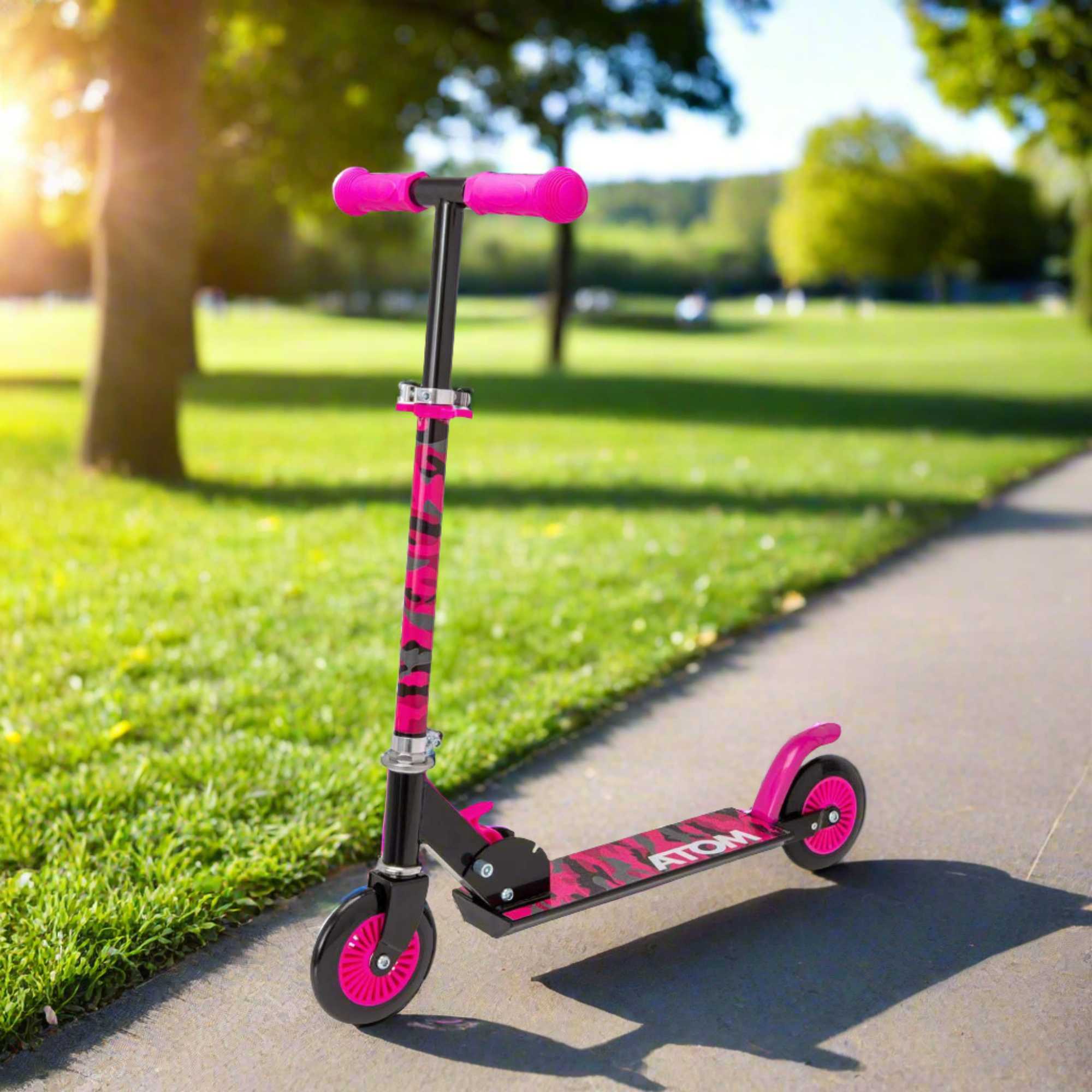 ATOM Inline 2-wheeled children's scooter in a stylish pink camouflage theme, featuring a durable design, eye-catching camouflage patterns, and a trendy look ideal for young riders