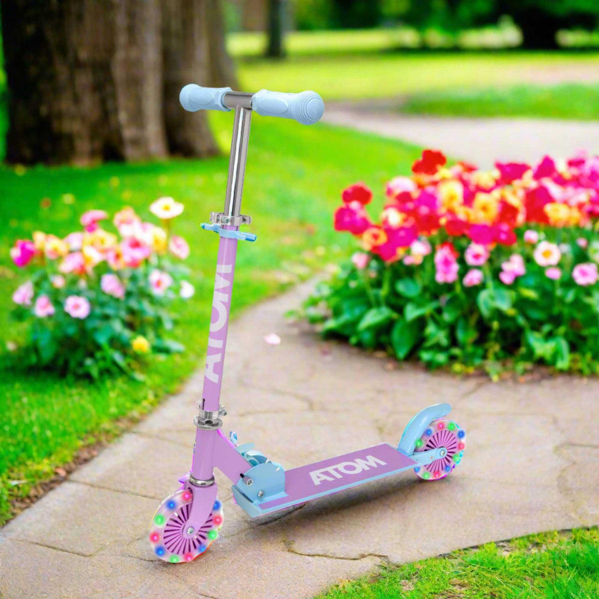 ATOM Inline Children&#39;s Kick Scooter in bright colours, designed for kids with a sturdy frame, adjustable handlebars, and smooth-rolling wheels, perfect for outdoor fun and active play.