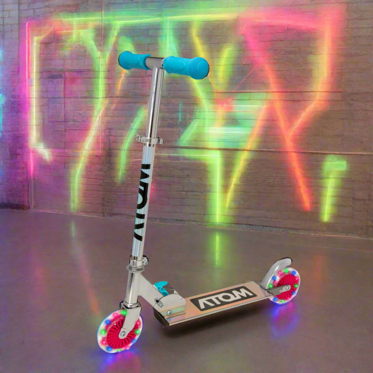 ATOM Inline Children&#39;s Kick Scooter in bright colours, designed for kids with a sturdy frame, adjustable handlebars, and smooth-rolling wheels, perfect for outdoor fun and active play.