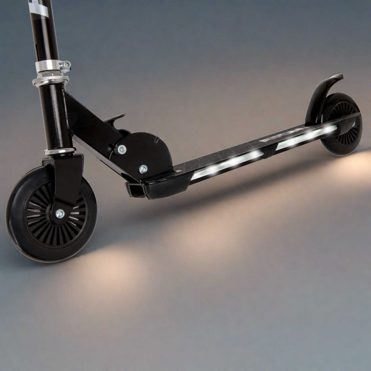 ATOM Night Flash 2-wheeled scooter for kids aged 5 and up, featuring LED light-up wheels, a sturdy frame, and adjustable handlebars, designed for safe and exciting rides.