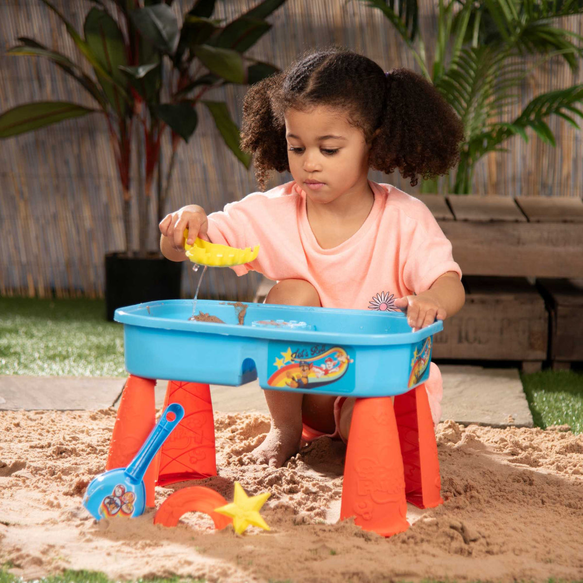 Paw Patrol Sand &amp; Water Play Table with accessories for kids, featuring sand and water compartments, perfect for outdoor play and Paw Patrol-themed adventures.