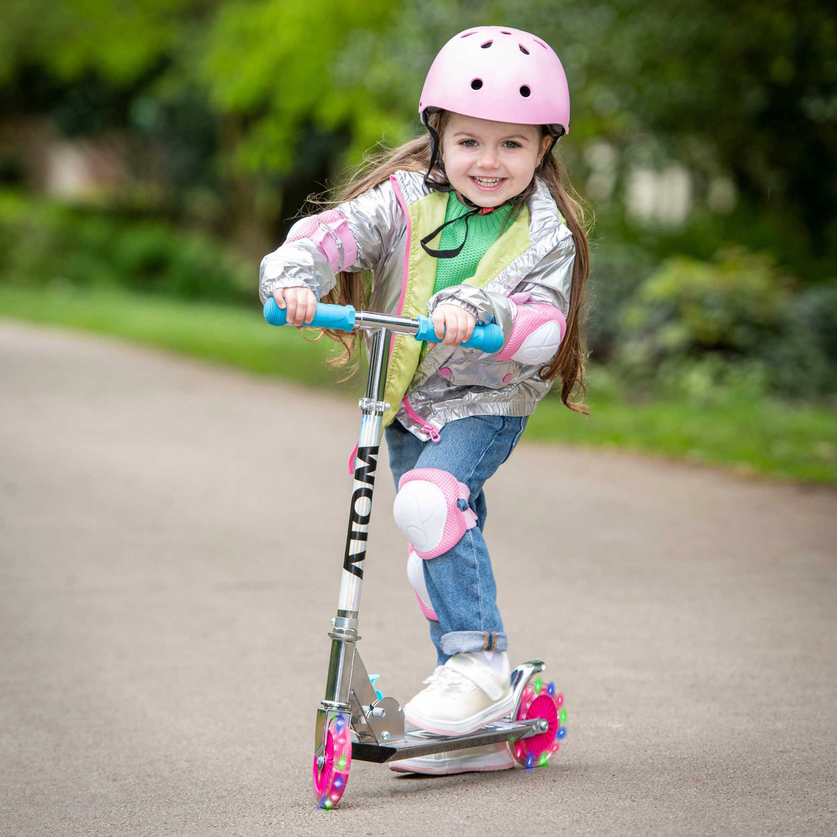 ATOM Inline Children&#39;s Kick Scooter in bright colours, designed for kids with a sturdy frame, adjustable handlebars, and smooth-rolling wheels, perfect for outdoor fun and active play.