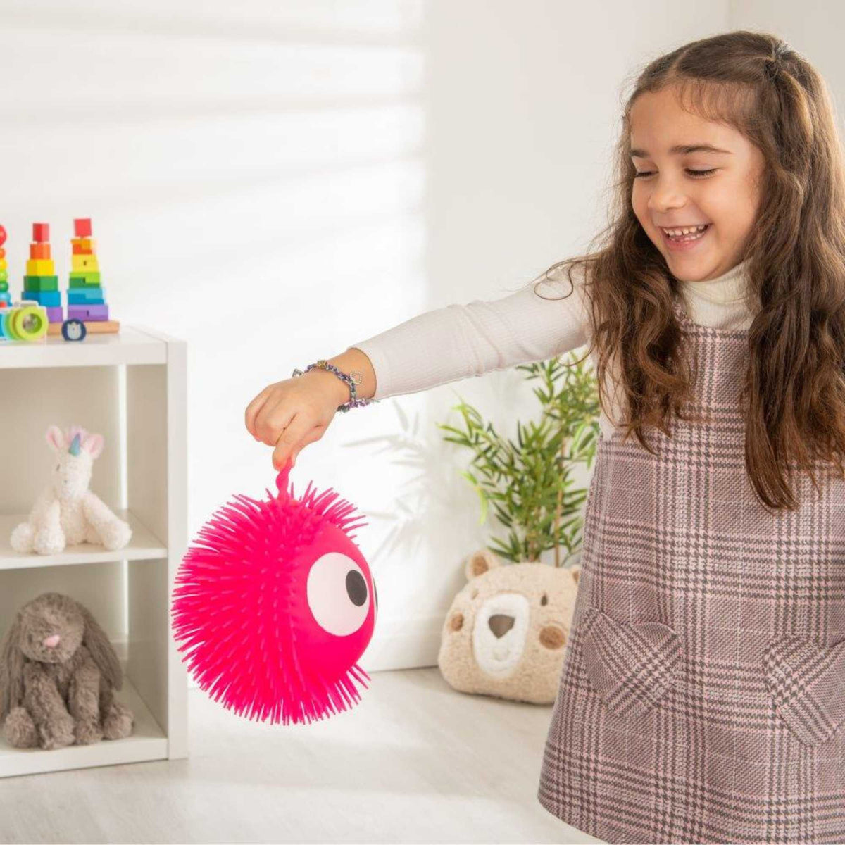 Collection of Fluffeez Balls in a display box, featuring 12 soft and fluffy balls in 6 vibrant colours, perfect for play and relaxation