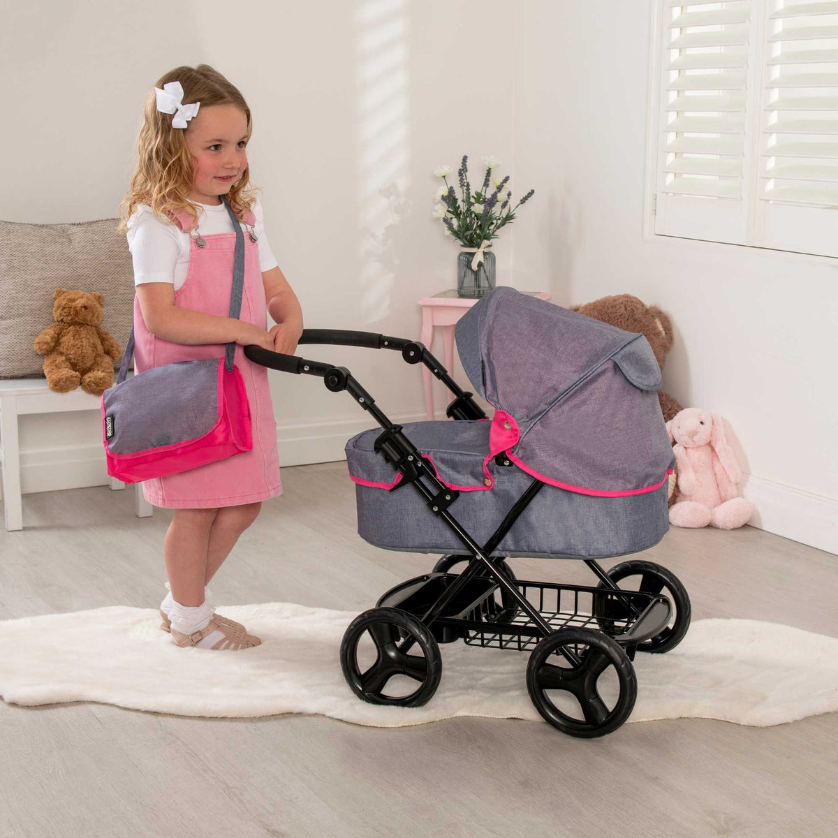 Mamas &amp; Papas Junior Ultima Dolls Pram, designed for children&#39;s play, featuring a classic and sturdy frame, adjustable handle height, and smooth-rolling wheels, ideal for nurturing imaginative play with dolls.