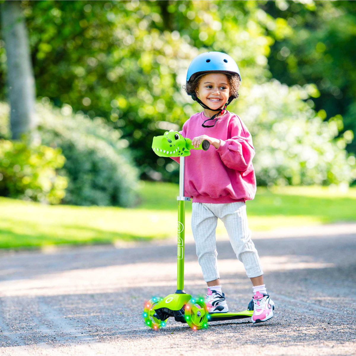 EVO Mini Cruiser Scooter , featuring a stable light up three-wheel design, adjustable handlebars, and lightweight, durable construction, perfect for young children’s outdoor adventures.