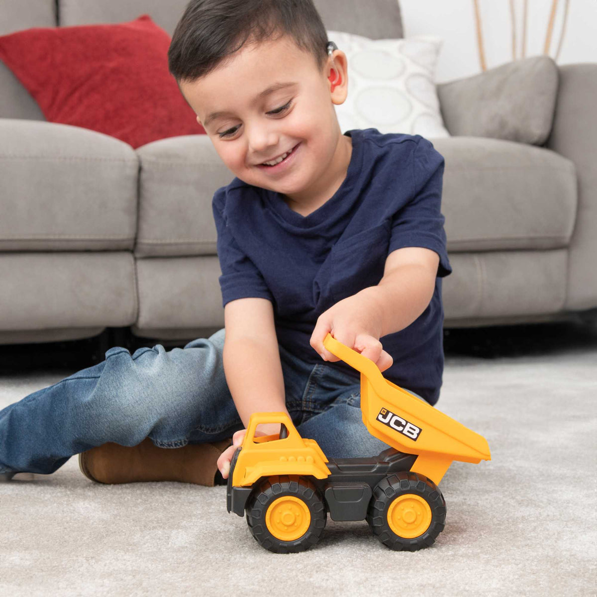 7-inch JCB Dump Truck Toy featuring realistic design, rugged wheels, and a functional dump bed, perfect for indoor and outdoor play for children.