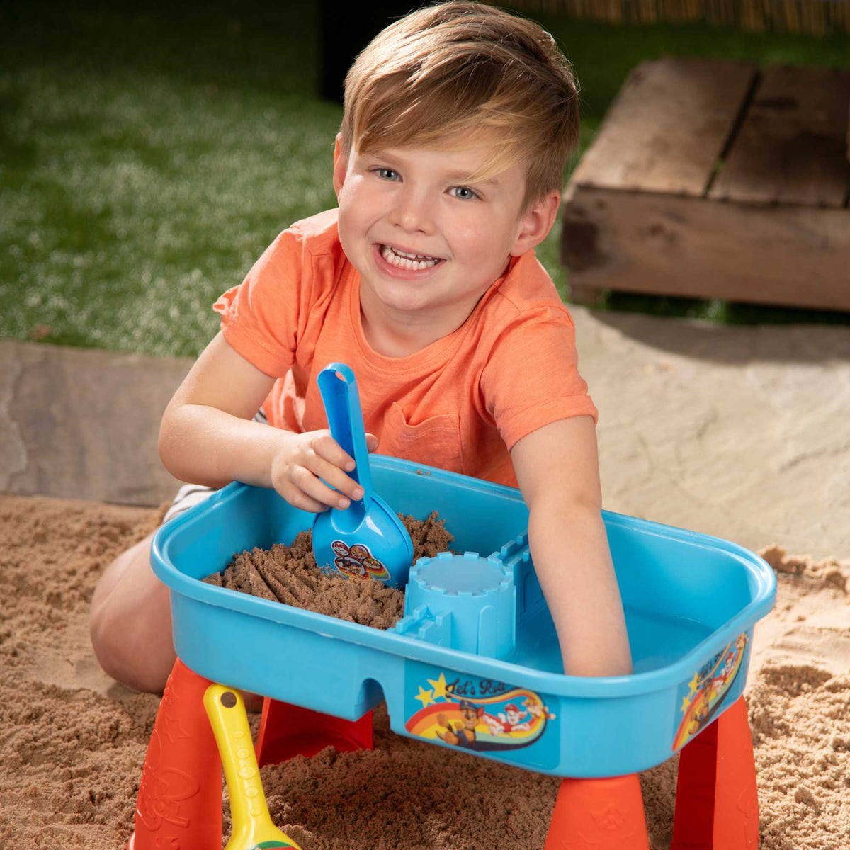 Paw Patrol Sand &amp; Water Play Table with accessories for kids, featuring sand and water compartments, perfect for outdoor play and Paw Patrol-themed adventures.