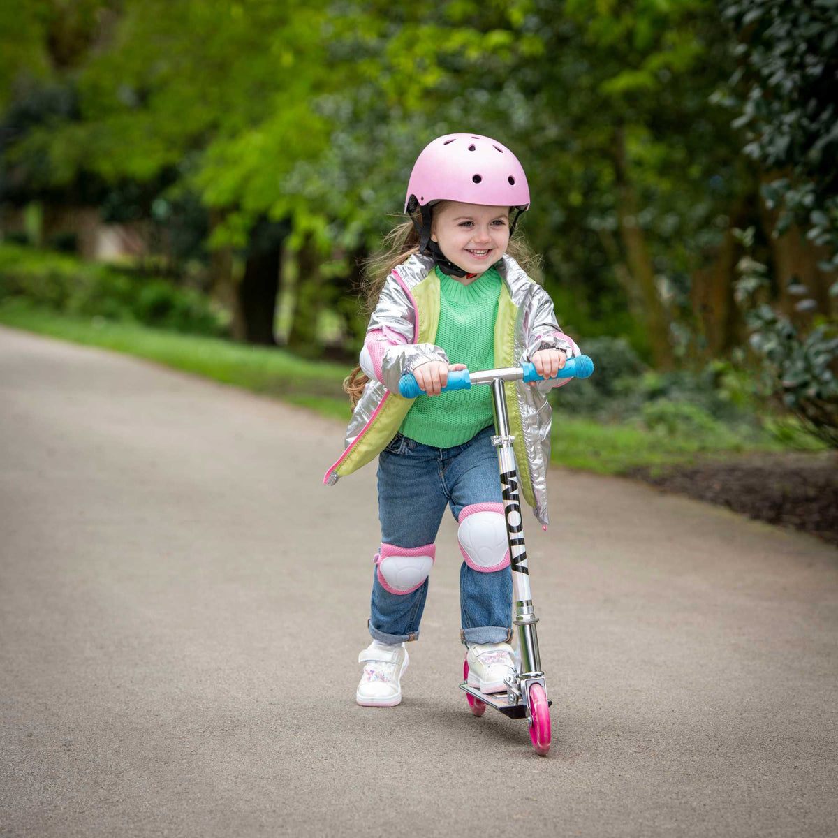 ATOM Inline Children&#39;s Kick Scooter in bright colours, designed for kids with a sturdy frame, adjustable handlebars, and smooth-rolling wheels, perfect for outdoor fun and active play.