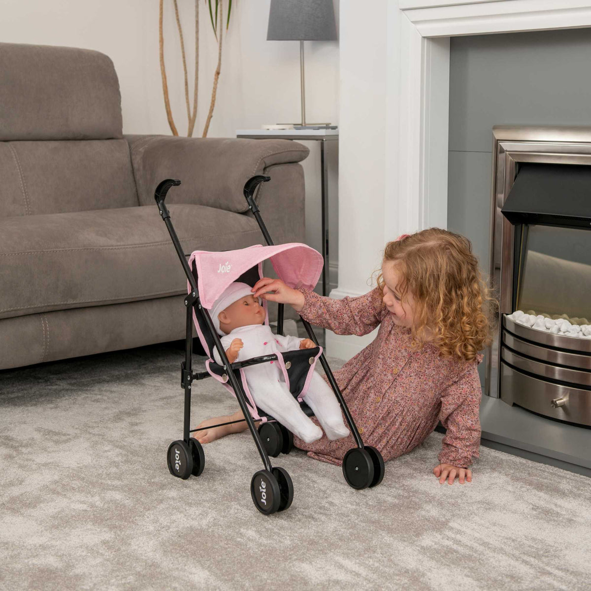 Stylish and compact toy pushchair designed for dolls, featuring a lightweight frame, easy-to-manoeuvre wheels, and a comfortable handle. Perfect for children to take their favourite dolls on the go, with a sleek and modern design.