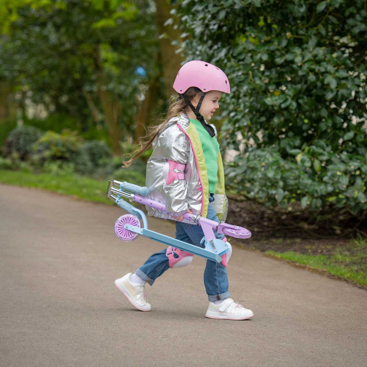 ATOM Inline Children&#39;s Kick Scooter in bright colours, designed for kids with a sturdy frame, adjustable handlebars, and smooth-rolling wheels, perfect for outdoor fun and active play.