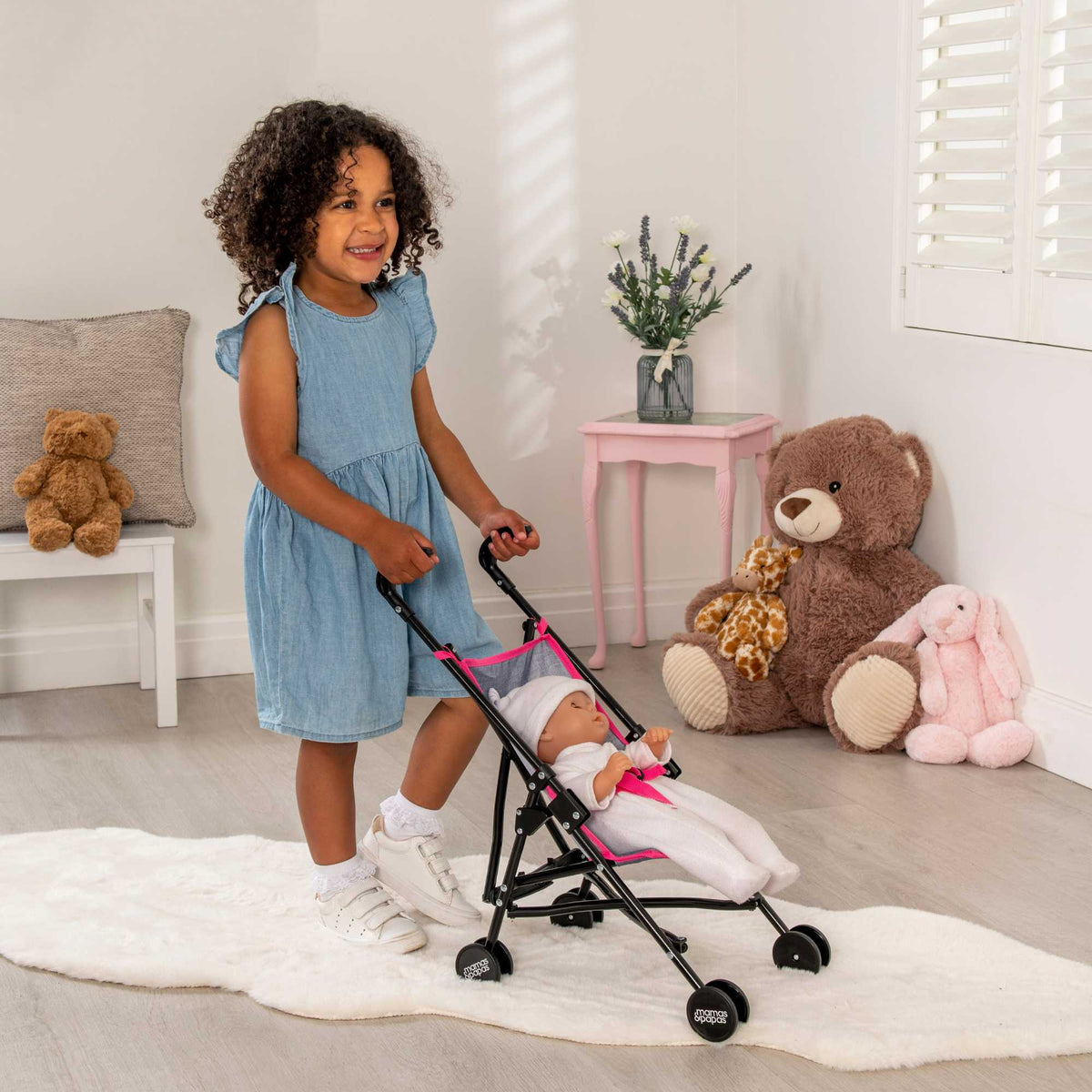 Mamas &amp; Papas Dolls Nursery Playset featuring a variety of accessories for imaginative play, including a crib, high chair, and accessories, perfect for nurturing pretend play with dolls.