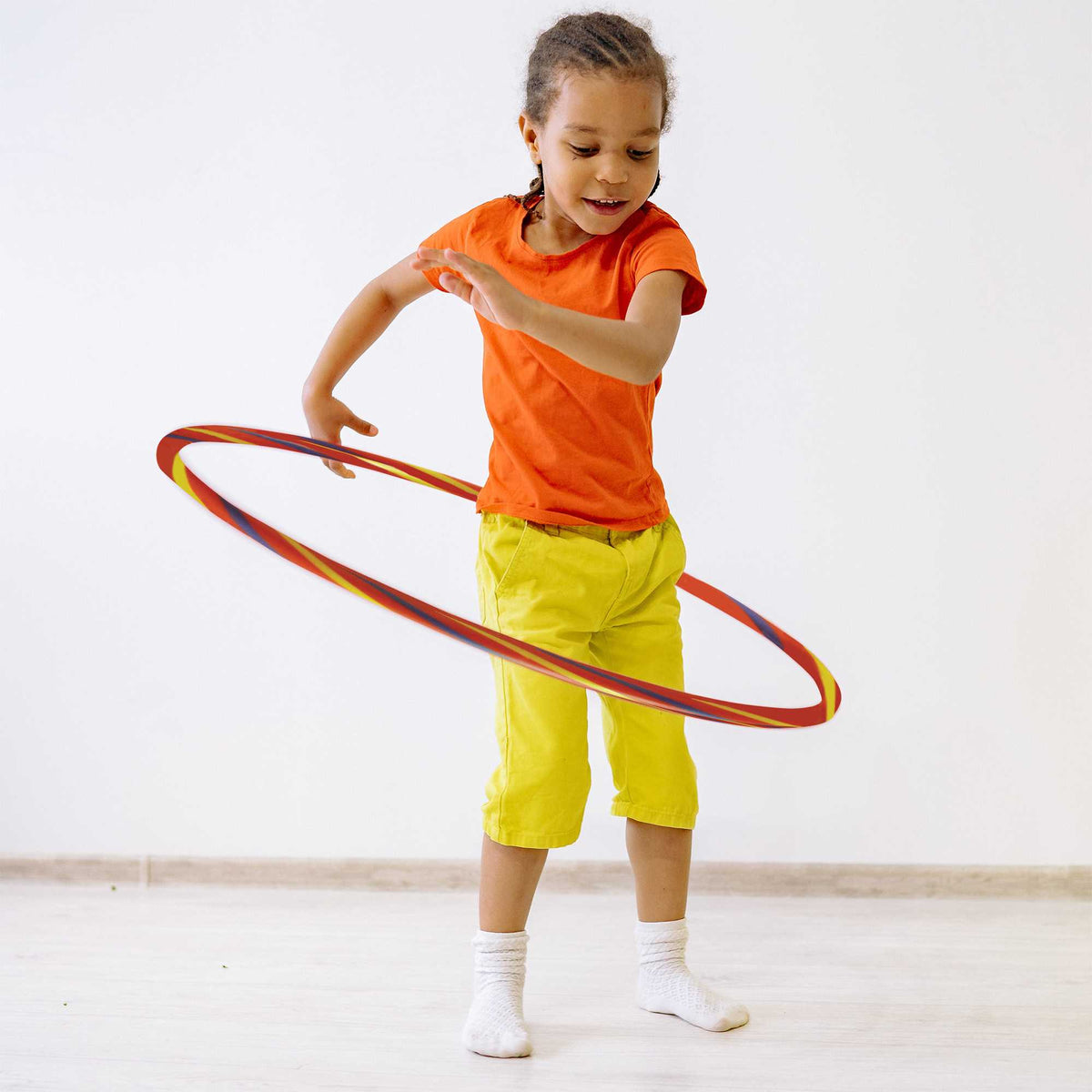 Rainbow Hula Hoops, a pack of four lightweight, durable hoops in bright rainbow colours. Ideal for parties, picnics, and outdoor fun, promoting movement, coordination, and social play for all ages.