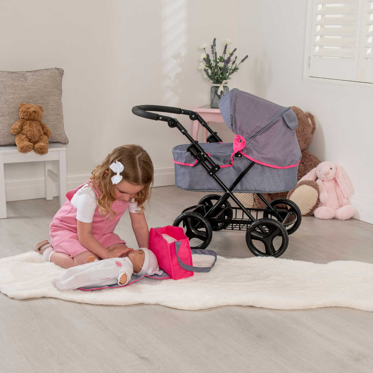 Mamas &amp; Papas Junior Ultima Dolls Pram, designed for children&#39;s play, featuring a classic and sturdy frame, adjustable handle height, and smooth-rolling wheels, ideal for nurturing imaginative play with dolls.