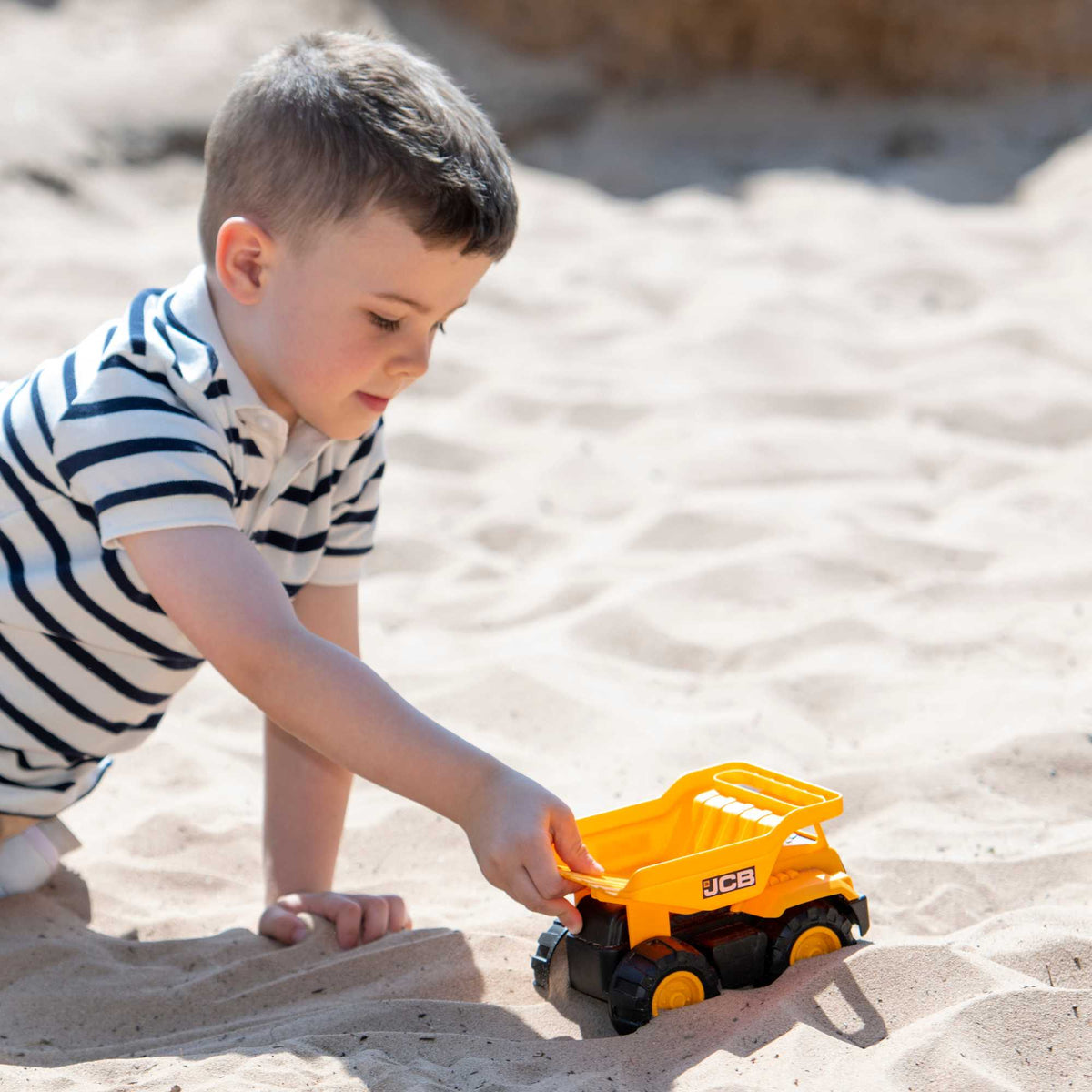 7-inch JCB Dump Truck Toy featuring realistic design, rugged wheels, and a functional dump bed, perfect for indoor and outdoor play for children.