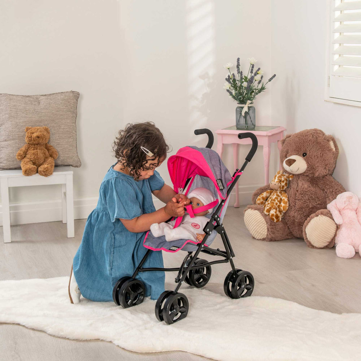 Mamas &amp; Papas Junior Cruise Stroller, designed for children&#39;s imaginative play, featuring a sleek and modern design with sturdy frame and smooth-rolling wheels, perfect for pretend outings with dolls.