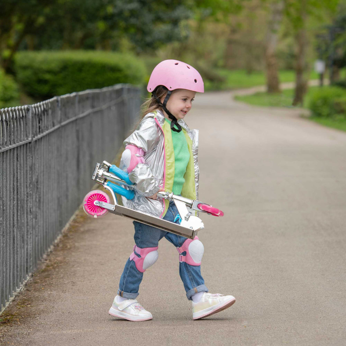 ATOM Inline Children&#39;s Kick Scooter in bright colours, designed for kids with a sturdy frame, adjustable handlebars, and smooth-rolling wheels, perfect for outdoor fun and active play.