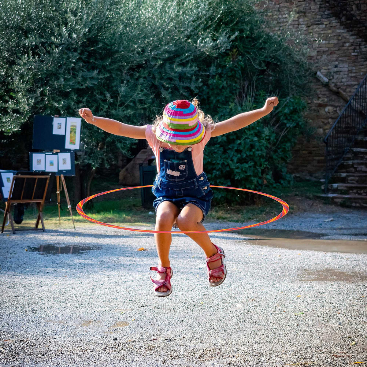 Rainbow Hula Hoops, a pack of four lightweight, durable hoops in bright rainbow colours. Ideal for parties, picnics, and outdoor fun, promoting movement, coordination, and social play for all ages.