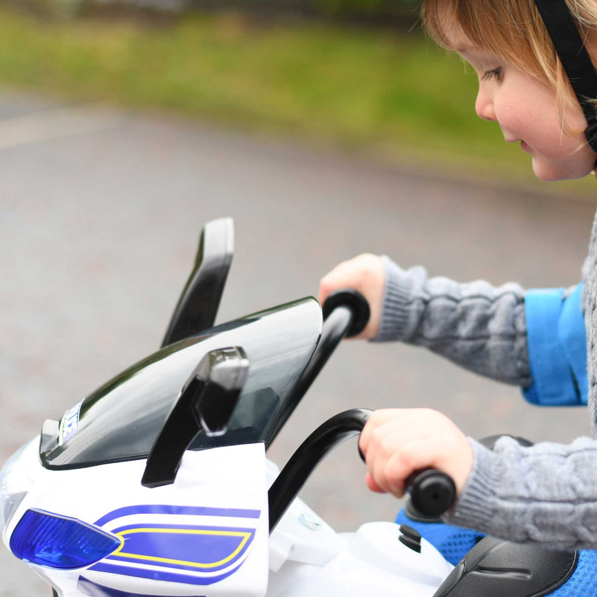 EVO Police Sport Bike Ride On for ages 2+, featuring a realistic police bike design with flashing lights and authentic sounds, durable frame, wide stable wheels, and easy-grip handles for safe and exciting outdoor play.