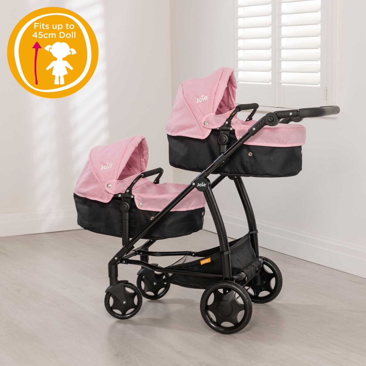 Joie Evalite Twin Dolls Pram with 9 play modes, featuring a stylish design in pink and black, adjustable handle height, swivel wheels, and a large storage basket, perfect for versatile and imaginative play with dolls.