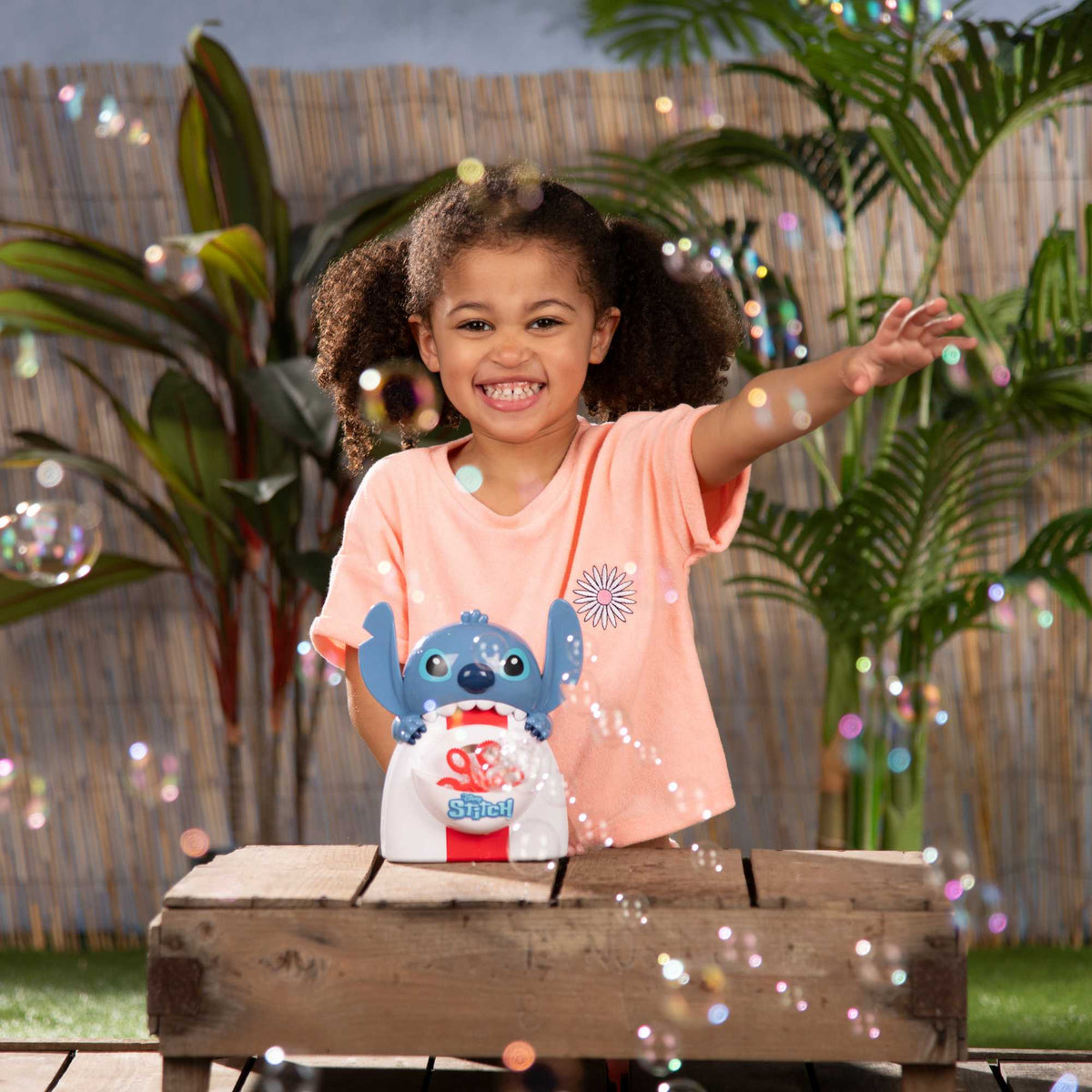 Stitch Bubble Machine featuring Disney&#39;s Stitch design, blowing hundreds of bubbles for kids&#39; outdoor fun, perfect for playdates, parties, and active play