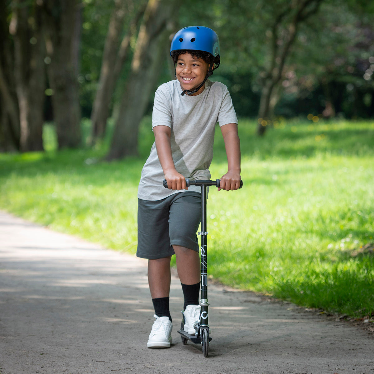 EVO Children&#39;s Inline Scooter for Kids Ages 5 and Up with Adjustable Handlebar, perfect for enhancing motor skills and outdoor fun.