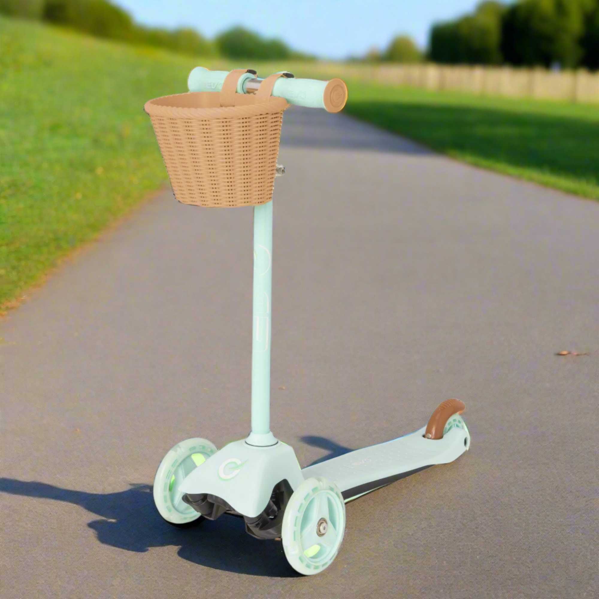 EVO Mini Cruiser Scooter with Basket, featuring a stable three-wheel design, adjustable handlebars, and lightweight, durable construction, perfect for young children’s outdoor adventures.