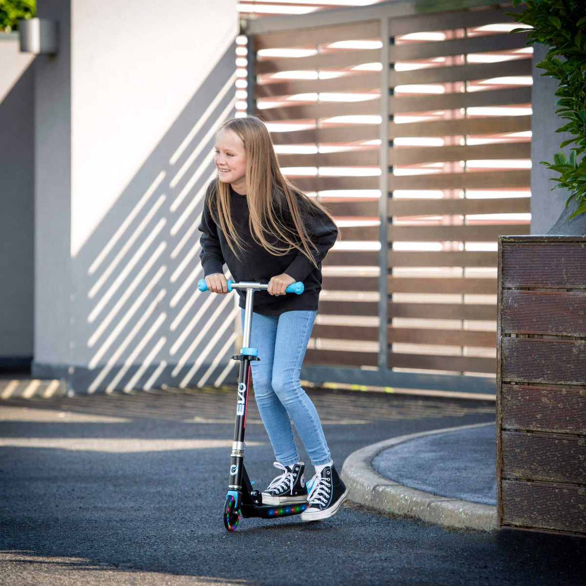 EVO Children&#39;s Light Up Light Blast Scooter for Kids Ages 5 and Up with LED Wheels and Adjustable Handlebar , perfect for enhancing motor skills and outdoor fun.