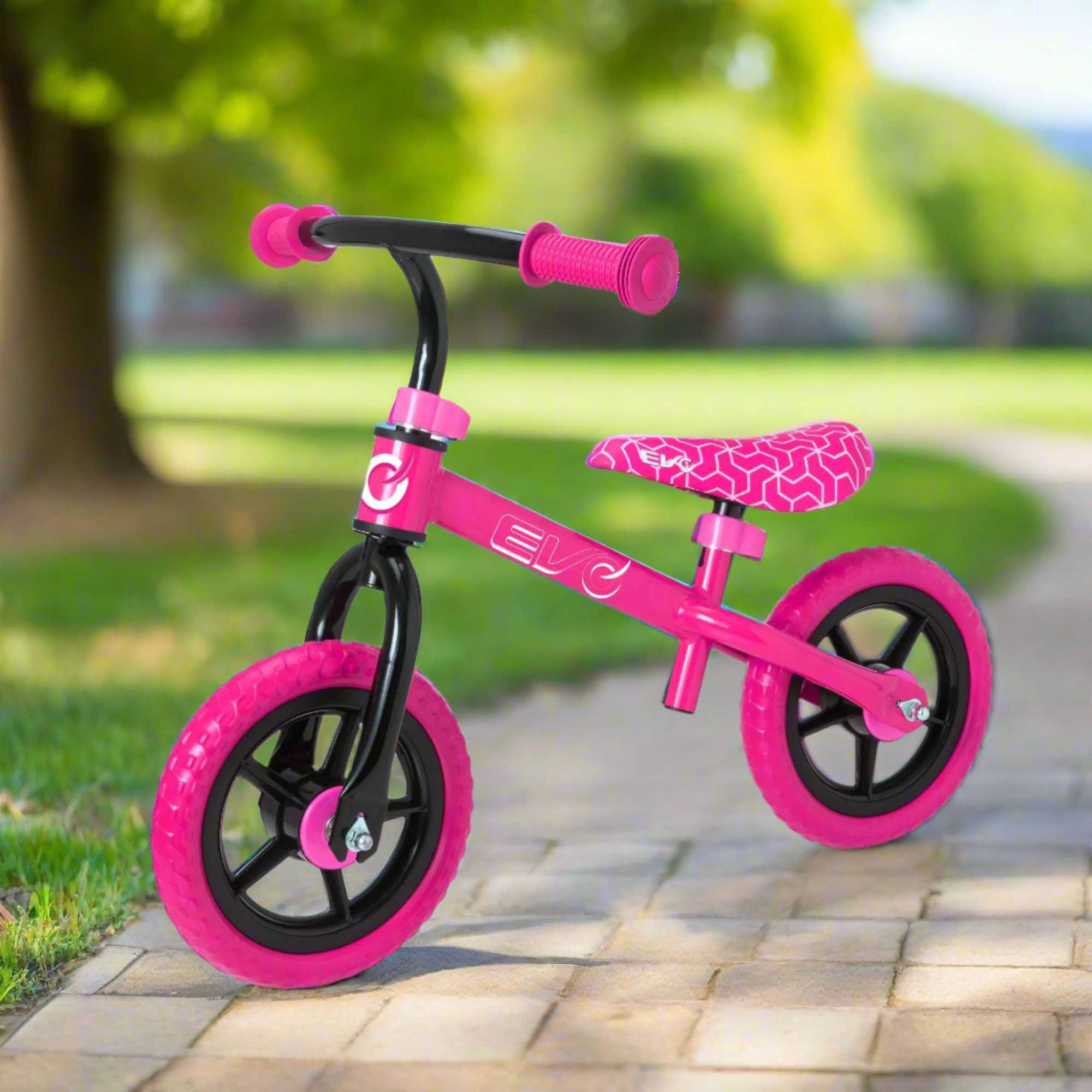 Child riding the EVO Balance Bike outdoors, showcasing the lightweight and durable design perfect for young learners to develop their balance and coordination skills