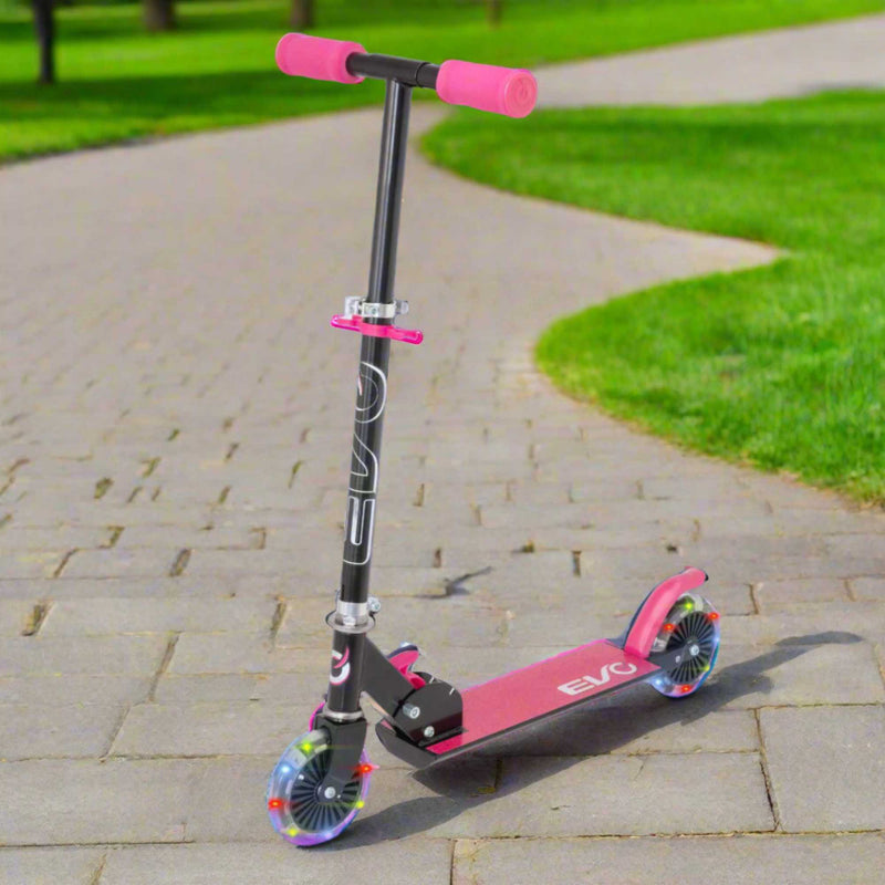 EVO Children's Light Up Inline Scooter for Kids Ages 5 and Up with LED Wheels and Adjustable Handlebar, perfect for enhancing motor skills and outdoor fun.