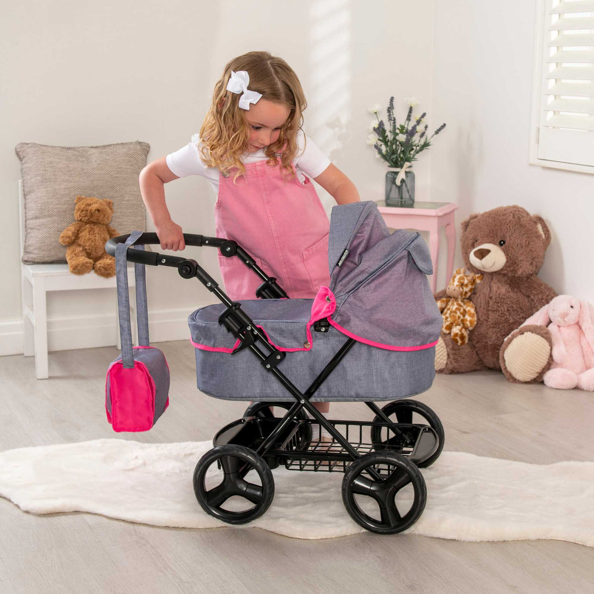 Mamas &amp; Papas Junior Ultima Dolls Pram, designed for children&#39;s play, featuring a classic and sturdy frame, adjustable handle height, and smooth-rolling wheels, ideal for nurturing imaginative play with dolls.