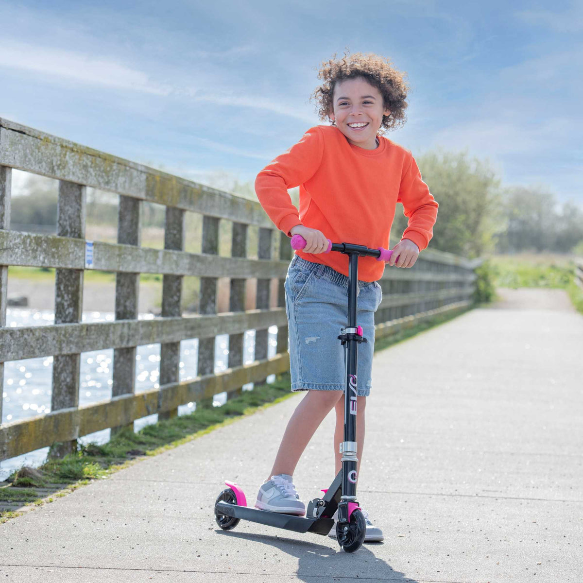 EVO Children&#39;s Light Up Light Blast Scooter for Kids Ages 5 and Up with LED Wheels and Adjustable Handlebar , perfect for enhancing motor skills and outdoor fun.