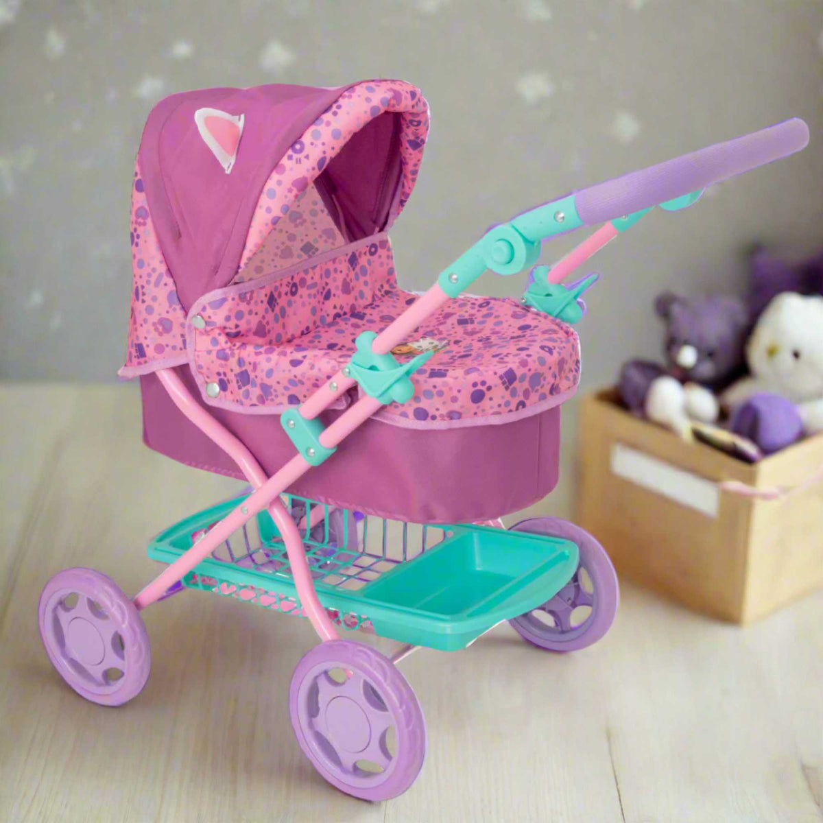 Adorable and colourful toy pram inspired by Gabby&#39;s Dollhouse, perfect for children to transport their favourite dolls and stuffed animals. Features include a sturdy frame, easy-to-push wheels, and playful designs with popular characters from the show. 