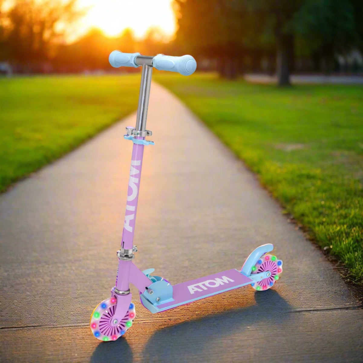 ATOM Inline Children&#39;s Kick Scooter in bright colours, designed for kids with a sturdy frame, adjustable handlebars, and smooth-rolling wheels, perfect for outdoor fun and active play.