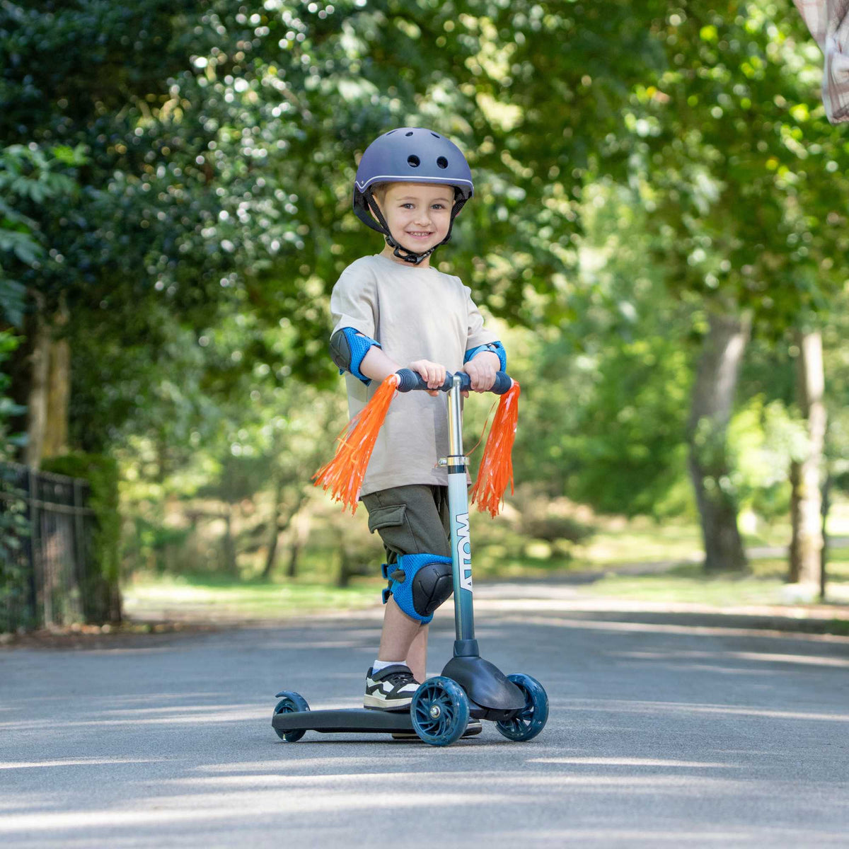 ATOM Eclipse Kids 3 Wheeled Scooter in vibrant solar theme, featuring a sturdy design, bright colors, and a space-inspired pattern perfect for young riders