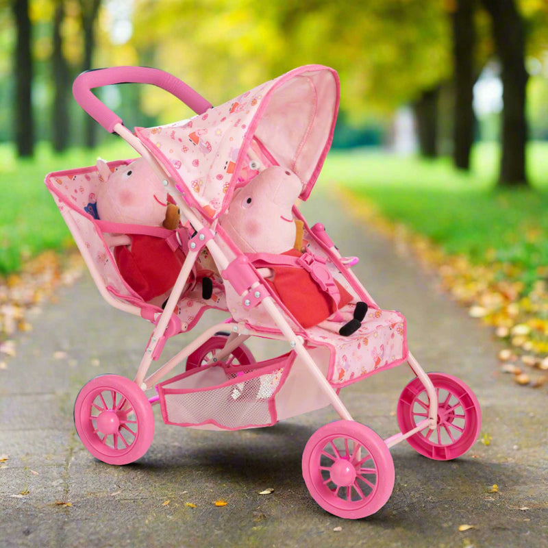 Peppa Pig Tandem Twin Doll Stroller: A pink double stroller with Peppa Pig graphics, designed for carrying two dolls side by side, ideal for toddlers and imaginative play.