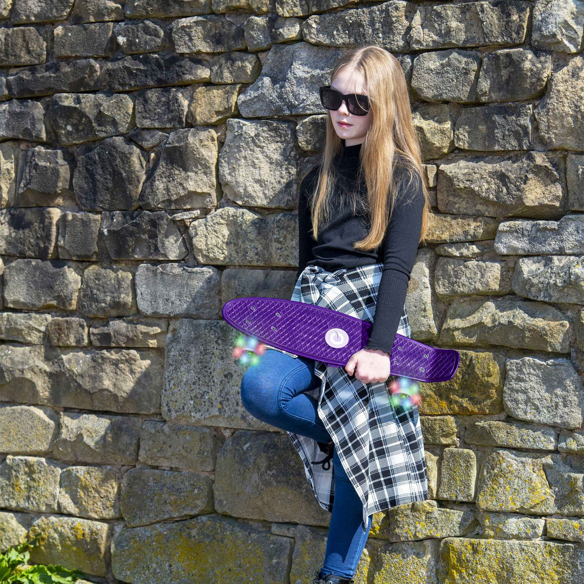 Children’s EVO 22-inch Penny Board in pink with light-up wheels, showcasing a compact design and vibrant retro style, perfect for young riders. The board features a textured grip surface and smooth, illuminated wheels that light up during movement. 