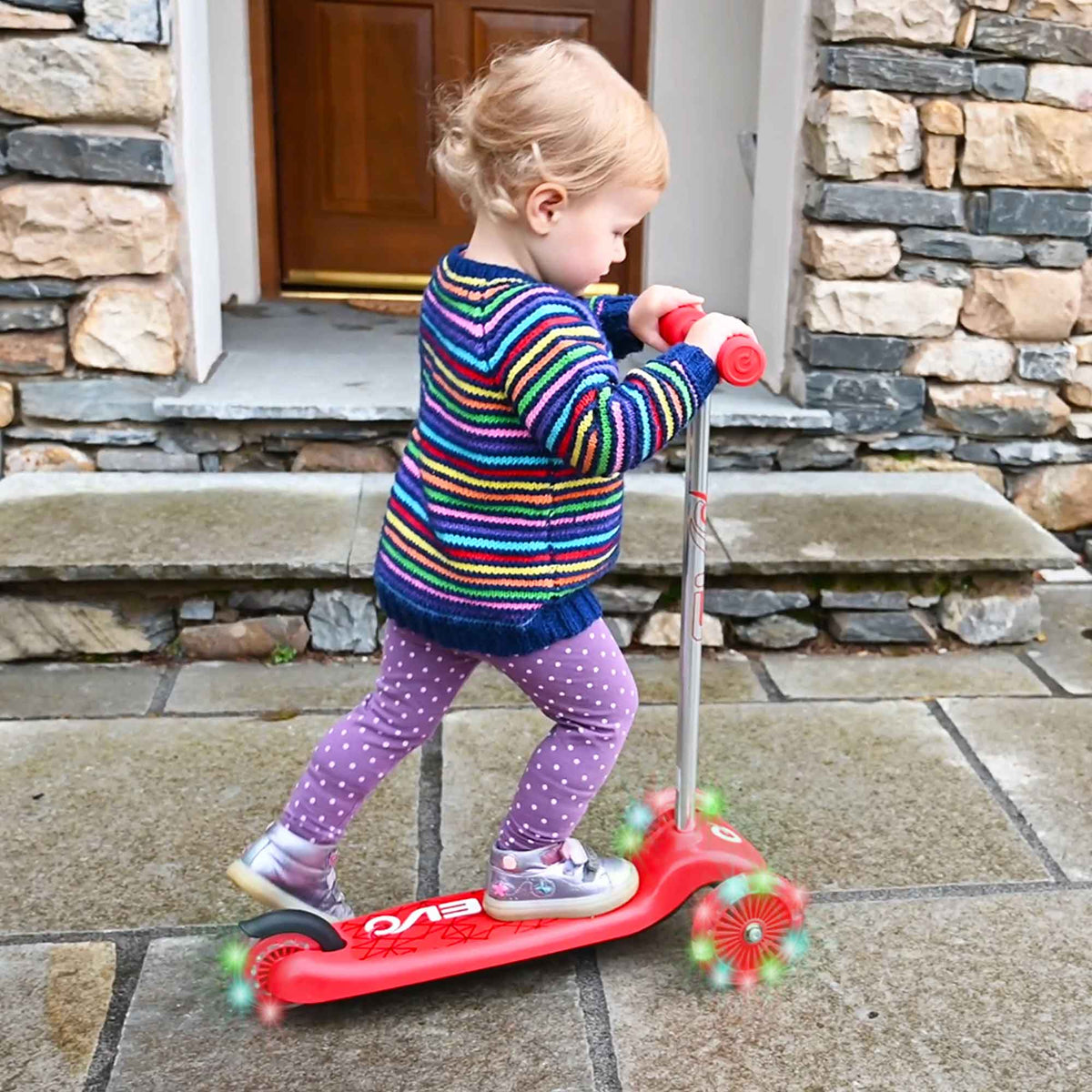 EVO Light Up Move N Groove Scooter for Ages 2 and Up with Lean-to-Steer System and LED Wheels, perfect for young children’s outdoor adventures.