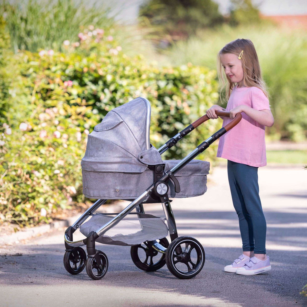 Mamas &amp; Papas Premium Occaro Pram set, a stylish dolls stroller with an adjustable hood, premium fabric, chunky chrome frame, and leather handles. Features front swivel wheels and folds flat for easy storage, mimicking the real-life version.